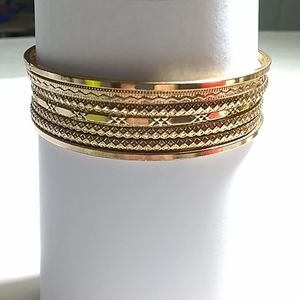 7 faux gold bracelets.